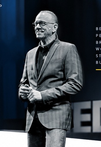 Michael Puck speaking on stage